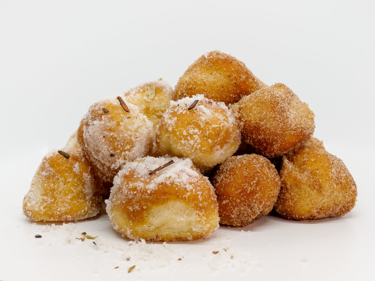 Box of donut holes rolled in cinnamon sugar or chai masala sugar or both